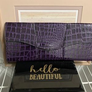 Purple envelope clutch